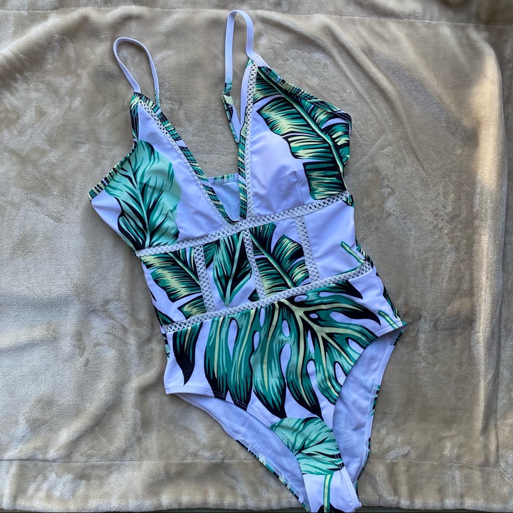 1-piece swim suit. Never worn!